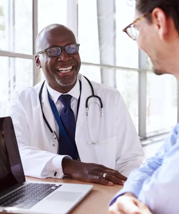 doctor smiling to a patient.