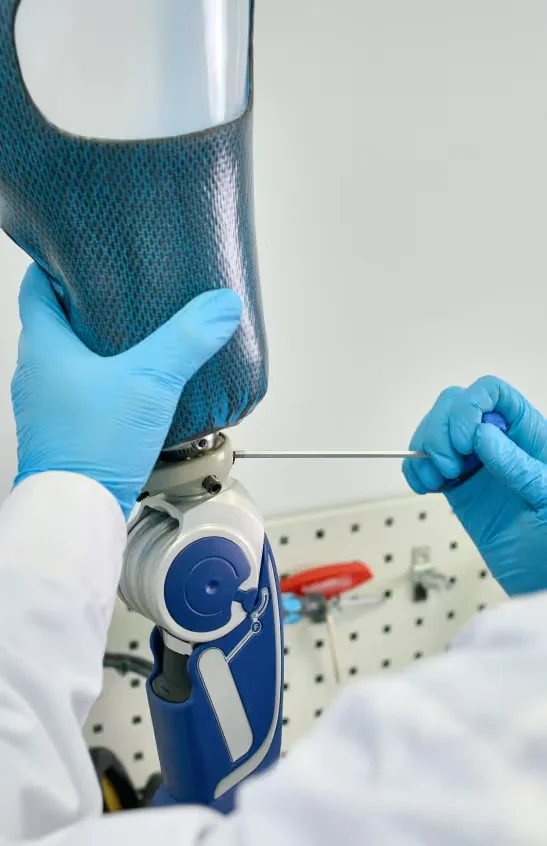 assembling a prosthetic leg by a technician.